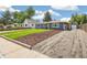 Charming home with a manicured front yard and a gravel driveway, showcasing great curb appeal and landscaping at 309 W Oak St, Lafayette, CO 80026
