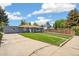 This house has a lush lawn, tidy landscaping, and a concrete driveway enhancing its welcoming curb appeal at 309 W Oak St, Lafayette, CO 80026