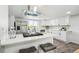 Modern kitchen showcasing stainless steel refrigerator, island and white cabinets at 309 W Oak St, Lafayette, CO 80026