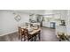 Kitchen and dining area featuring an island, and seating at 309 W Oak St, Lafayette, CO 80026