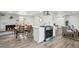 Kitchen showcasing an island, dining area and new sliding barn doors at 309 W Oak St, Lafayette, CO 80026