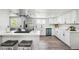 Well-lit kitchen boasting stainless steel appliances, a breakfast bar, and modern finishes at 309 W Oak St, Lafayette, CO 80026