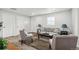 Cozy living room with neutral decor, a plush rug, and ample natural light at 309 W Oak St, Lafayette, CO 80026