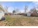 Spacious fenced backyard with a shed, perfect for outdoor activities and relaxation at 5562 Anaheim Way, Denver, CO 80239