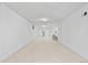 Spacious finished basement with carpet and wood paneled walls at 5562 Anaheim Way, Denver, CO 80239