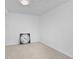 Carpeted basement room featuring a decorative clock at 5562 Anaheim Way, Denver, CO 80239