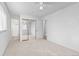 Spacious bedroom with light-colored carpet and mirrored closet at 5562 Anaheim Way, Denver, CO 80239