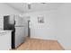 Bright eat-in kitchen featuring stainless steel refrigerator and plenty of cabinet space at 5562 Anaheim Way, Denver, CO 80239