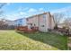 A spacious backyard with a large wooden deck perfect for entertaining and enjoying the outdoors at 12134 Glencoe St, Thornton, CO 80241