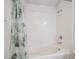 This bright bathroom features a shower-tub combo, perfect for relaxing and unwinding after a long day at 2846 W Centennial Dr # E, Littleton, CO 80123