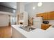 Bright kitchen boasts stainless steel sink and efficient appliances with seamless transition to the living space at 2846 W Centennial Dr # E, Littleton, CO 80123