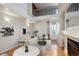 Spacious living room with high ceilings, modern decor, and a staircase to a loft area at 2846 W Centennial Dr # E, Littleton, CO 80123