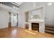 This living room features a cozy fireplace and hardwood floors, creating a warm and inviting space to relax at 2846 W Centennial Dr # E, Littleton, CO 80123