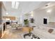 Bright, open-concept living area with hardwood floors, modern furnishings, and a cozy fireplace at 2846 W Centennial Dr # E, Littleton, CO 80123