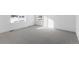 A bedroom featuring gray carpet, white walls, and ample natural light at 14245 Currant St, Broomfield, CO 80020