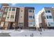 Modern townhouse with a mix of brick and siding, and a convenient front ramp for accessibility at 14245 Currant St, Broomfield, CO 80020