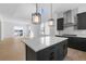 Modern kitchen with gray cabinets, stainless steel appliances and a central island at 14245 Currant St, Broomfield, CO 80020