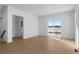 Bright and airy living room boasts wood floors and large windows offering scenic outdoor views at 14245 Currant St, Broomfield, CO 80020