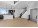 Bright living room with open floor plan, hardwood floors, modern staircase and open kitchen at 14245 Currant St, Broomfield, CO 80020