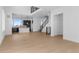Bright open-concept living room with hardwood floors, modern staircase and open kitchen at 14245 Currant St, Broomfield, CO 80020