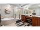 Well-lit bathroom with a separate tub and shower, plus double vanity at 8100 E. Union Ave # 409, Denver, CO 80237