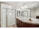 Fresh bathroom with large glass shower and modern sink with granite countertop at 8100 E. Union Ave # 409, Denver, CO 80237
