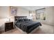 Comfortable bedroom with large window offering city views and plush carpet at 8100 E. Union Ave # 409, Denver, CO 80237