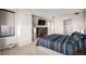 Airy bedroom with a large window, mounted TV, and ample closet space at 8100 E. Union Ave # 409, Denver, CO 80237