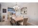 Inviting dining room area with natural light and comfortable seating for six at 8100 E. Union Ave # 409, Denver, CO 80237