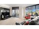 Bright living room with large windows, balcony access, and city views at 8100 E. Union Ave # 409, Denver, CO 80237