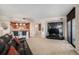 Open-concept living room with a kitchen island and integrated entertainment center at 8100 E. Union Ave # 409, Denver, CO 80237
