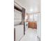 Bright kitchen with wooden cabinets, white appliances, and a convenient stacked washer and dryer unit at 4656 S Dillon Ct # D, Aurora, CO 80015