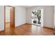 Bright living room with wood floors and sliding glass doors, offering a view of the outdoors at 4656 S Dillon Ct # D, Aurora, CO 80015