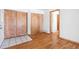 Open living space featuring hardwood flooring, a closet, and entrance to an adjacent room at 4656 S Dillon Ct # D, Aurora, CO 80015