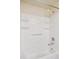 Clean shower with white showerhead and convenient soap and shampoo shelving at 4656 S Dillon Ct # D, Aurora, CO 80015