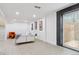 Finished basement featuring an open floor plan and sliding door access at 7114 S Costilla St, Littleton, CO 80120