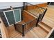 New wood deck with staircase leading to walkout basement entry at 7114 S Costilla St, Littleton, CO 80120