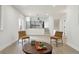 Spacious living area showcasing an open layout with modern furnishings and lots of natural light at 7114 S Costilla St, Littleton, CO 80120