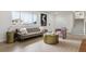 Bright living room features modern decor, light floors, neutral color palette, and a sun-filled view at 7114 S Costilla St, Littleton, CO 80120