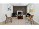 Stylish living room featuring contemporary decor, a decorative wall, and ample natural light at 7114 S Costilla St, Littleton, CO 80120