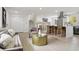 Open concept living space featuring modern decor, a sleek kitchen, and comfortable seating areas for relaxation and entertainment at 7114 S Costilla St, Littleton, CO 80120