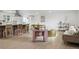 Open concept living space, seamlessly connecting the kitchen, dining, and living areas for modern entertaining at 7114 S Costilla St, Littleton, CO 80120