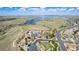 Aerial view of a community with a clubhouse, pool, and nearby lake, with a walking path at 7202 S Valleyhead Ct, Aurora, CO 80016