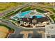 Modern clubhouse aerial view with a playground, pool, and ample parking at 7202 S Valleyhead Ct, Aurora, CO 80016