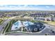 Community clubhouse aerial view showcasing pool, playground, and surrounding neighborhood at 7202 S Valleyhead Ct, Aurora, CO 80016