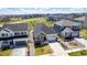 Aerial view of a home highlighting its well-manicured landscaping, proximity to other houses, and street access at 7202 S Valleyhead Ct, Aurora, CO 80016