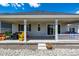 The backyard has a spacious covered porch perfect for outdoor entertaining and relaxation at 7202 S Valleyhead Ct, Aurora, CO 80016