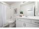 Bright bathroom with white vanity, shower with tub combo, and tile floors at 7202 S Valleyhead Ct, Aurora, CO 80016
