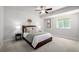 Cozy bedroom with a ceiling fan and bright window for natural light at 7202 S Valleyhead Ct, Aurora, CO 80016