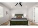 Cozy bedroom features a comfortable bed, accent pillows, and warm lighting at 7202 S Valleyhead Ct, Aurora, CO 80016